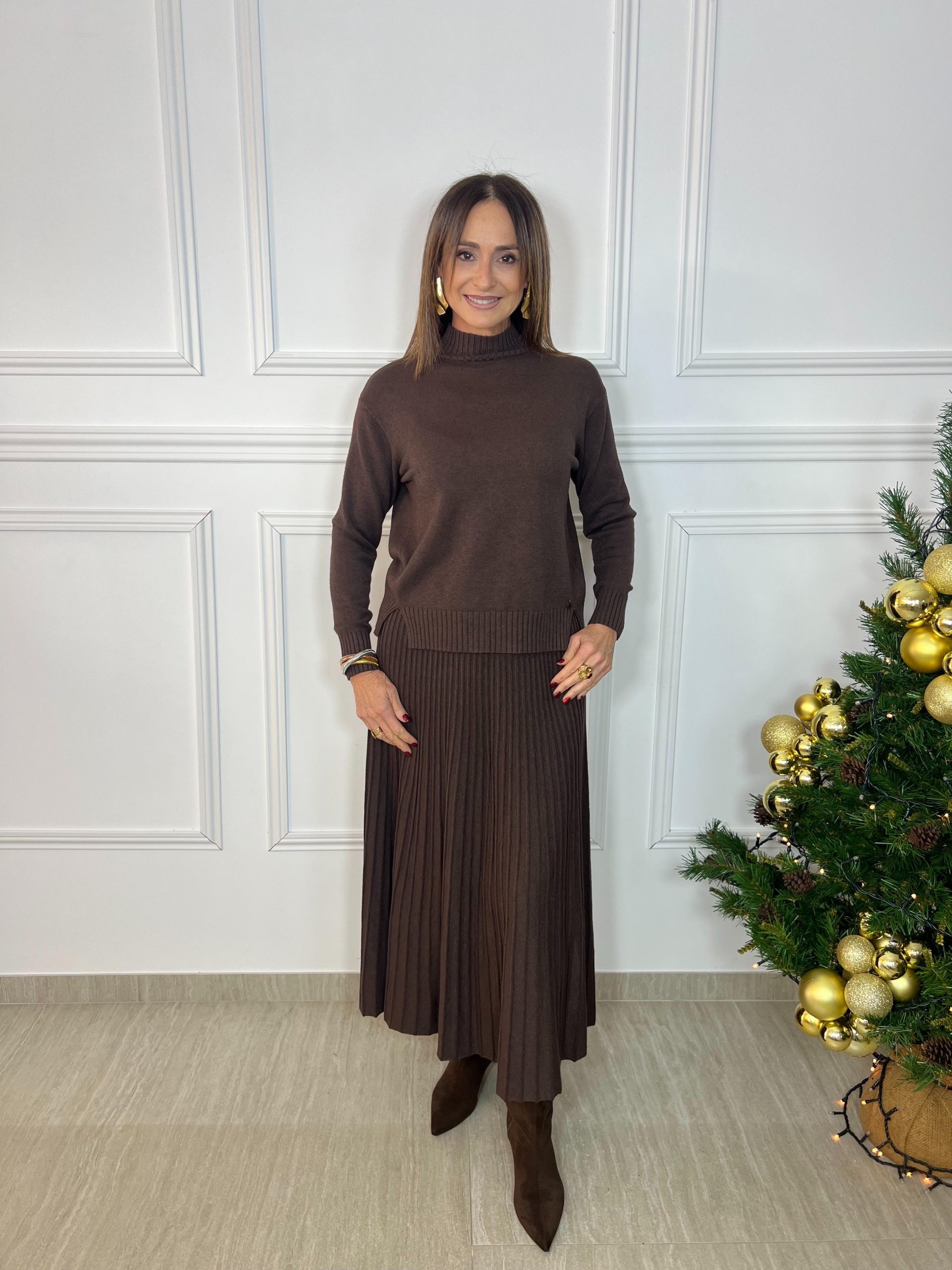 Falda de punto plisada midi con cintura elástica, talla única. Versátil, cómoda y elegante, perfecta para looks casuales o más arreglados. Oliva Valencia